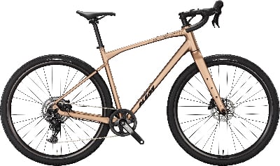 Ein braunes KTM Gravelbike mit schwarzen Rädern und schwarzem Lenker. Ein braunes KTM Gravelbike mit schwarzen Rädern und schwarzem Lenker.