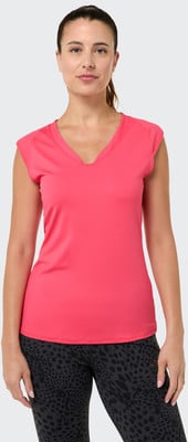 Frau in einem rosa V-Ausschnitt-Oberteil und gemusterten Leggings. Frau in einem rosa V-Ausschnitt-Oberteil und gemusterten Leggings.
