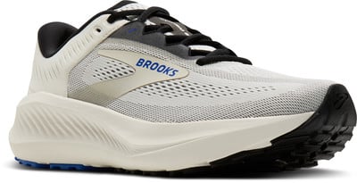 Weiße Brooks Laufschuhe mit schwarzen Schnürsenkeln und blauem Logo an der Seite. Weiße Brooks Laufschuhe mit schwarzen Schnürsenkeln und blauem Logo an der Seite.