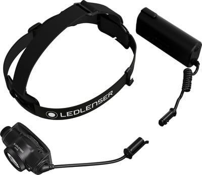 Schwarze Stirnlampe mit Akku und Kabel auf weißem Hintergrund. Schwarze Stirnlampe mit Akku und Kabel auf weißem Hintergrund.