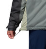 Detail einer Jacke mit verstellbarem Saum und Klettverschluss am Ärmel.