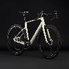 Ein hellgrünes Gravelbike mit schwarzen Rädern und Lenker.