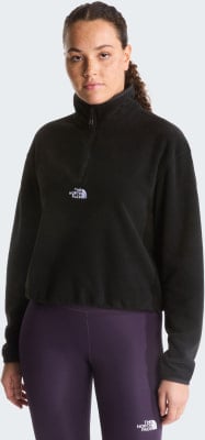 Schwarzer Fleece-Pullover für Damen mit The North Face Logo und lila Leggings. Schwarzer Fleece-Pullover für Damen mit The North Face Logo und lila Leggings.