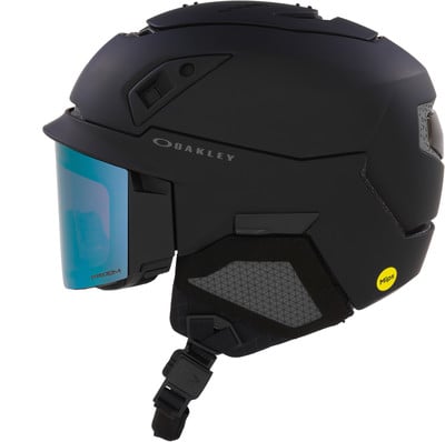Schwarzer Oakley Skihelm mit blauer Brille und gelbem MIPS-Aufkleber. Schwarzer Oakley Skihelm mit blauer Brille und gelbem MIPS-Aufkleber.