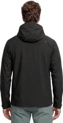 Mann in schwarzer Kapuzenjacke und grauer Hose von hinten. Mann in schwarzer Kapuzenjacke und grauer Hose von hinten.