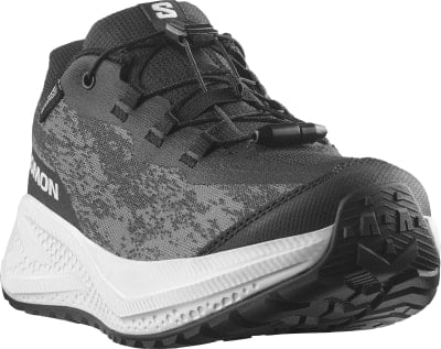 Schwarzer Salomon Laufschuh mit weißer Sohle und grauem Muster. Schwarzer Salomon Laufschuh mit weißer Sohle und grauem Muster.