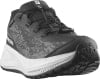 Schwarzer Salomon Laufschuh mit weißer Sohle und grauem Muster.