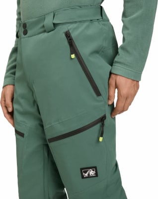 Grüne Skihose mit schwarzen Reißverschlüssen und Off Zone Logo. Grüne Skihose mit schwarzen Reißverschlüssen und Off Zone Logo.