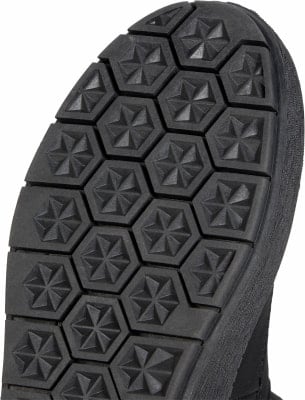 Schwarze Schuhsohle mit sechseckigem Sternmuster. Schwarze Schuhsohle mit sechseckigem Sternmuster.