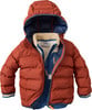 Gesteppte Jacke mit Kapuze in Ziegelrot mit dunkelblauem Futter.