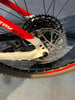 Detail eines Mountainbike-Hinterrads mit Kassette und Scheibenbremse.