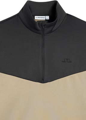 Ein schwarz-beiger Pullover mit J. Lindeberg-Logo und Reißverschluss.