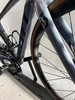 Rahmendetail eines Scott Rennrads mit Rädern und Kurbelgarnitur.