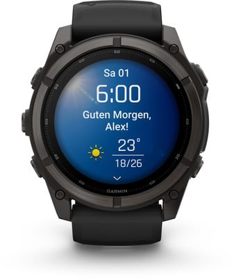Eine Smartwatch zeigt 6:00, das Datum und einen Morgengruß an. Eine Smartwatch zeigt 6:00, das Datum und einen Morgengruß an.