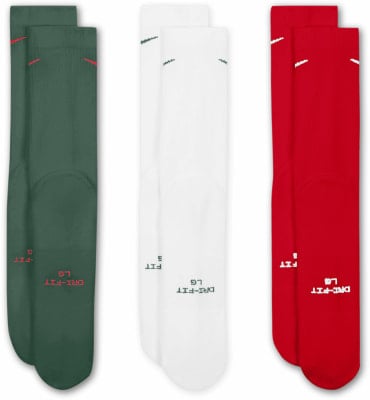 Drei Paar hohe Nike-Socken in Grün, Weiß und Rot. Drei Paar hohe Nike-Socken in Grün, Weiß und Rot.