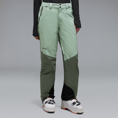 Damen-Skihose in Pastellgrün und Dunkelgrün mit farblichen Akzenten.