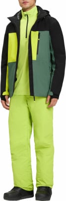 Mann in heller Skijacke mit Farbblöcken und grüner Skihose. Mann in heller Skijacke mit Farbblöcken und grüner Skihose.