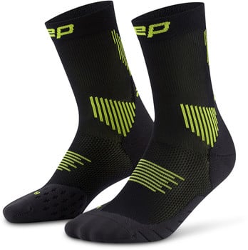 Schwarze Sportsocken mit neongrünen Details und Logo.