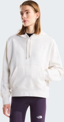 Frau im cremefarbenen Hoodie und lila Leggings mit Logo. Frau im cremefarbenen Hoodie und lila Leggings mit Logo.