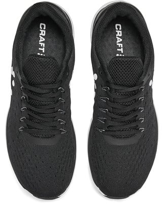 Schwarze Laufschuhe von Craft mit weißen Schnürsenkeln und Logo auf der Innensohle. Schwarze Laufschuhe von Craft mit weißen Schnürsenkeln und Logo auf der Innensohle.