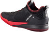 Schwarzer HEAD Tennisschuh mit roter Sohle und Logo.