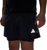 Schwarze Shorts mit integrierten Unterhosen und reflektierendem Logo.