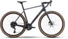 Grauer Gravelbike-Rahmen mit braunen Rädern und schwarzer Ausstattung.