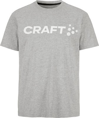 Graues T-Shirt mit weißem CRAFT-Logo und Punkten auf der Vorderseite.