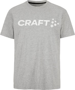 Graues T-Shirt mit weißem CRAFT-Logo und Punkten auf der Vorderseite.