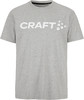 Graues T-Shirt mit weißem CRAFT-Logo und Punkten auf der Vorderseite.