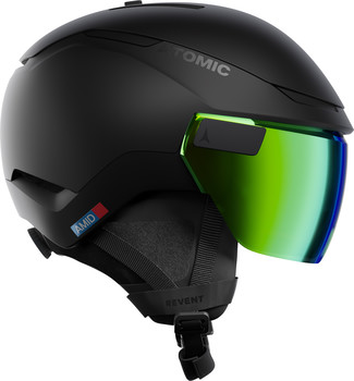 Schwarzer Atomic Skihelm mit integrierter grüner Visierscheibe und AMID-Aufschrift.