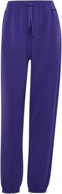 Lila Adidas Jogginghose mit Logo und Kordelzug. Lila Adidas Jogginghose mit Logo und Kordelzug.