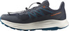 Dunkelblauer Laufschuh mit orangefarbenem Schriftzug und blauen Details.