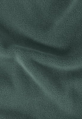 Dunkelgrüner Stoff mit feiner Textur und weichen Falten. Dunkelgrüner Stoff mit feiner Textur und weichen Falten.