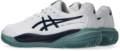 Weiße Asics Tennisschuhe mit dunkelblauen Streifen und grüner Sohle. Weiße Asics Tennisschuhe mit dunkelblauen Streifen und grüner Sohle.