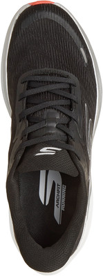 Schwarzer Laufschuh mit weißem Skechers-Logo und silbernem Detail. Schwarzer Laufschuh mit weißem Skechers-Logo und silbernem Detail.
