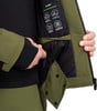 Detail einer Schöffel-Jacke mit Reißverschlusstasche und Markenlogo.