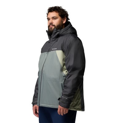 Mann in einer dunkelgrauen und hellgrauen Kapuzenjacke mit dunkelblauer Hose. Mann in einer dunkelgrauen und hellgrauen Kapuzenjacke mit dunkelblauer Hose.