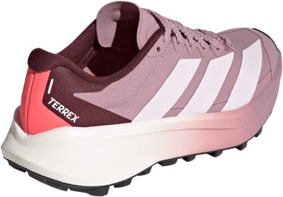 Damen-Trailrunning-Schuh von Adidas Terrex in Rosa mit weißen Streifen.