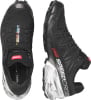 Schwarze Salomon Speedcross Laufschuhe mit weißem Muster auf der Sohle.