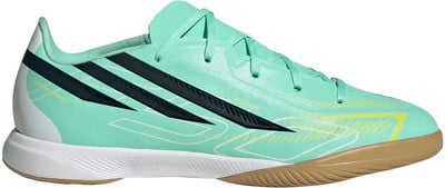 Damenfußballschuh in Mintgrün mit dunkelblauen Streifen und gelben Details. Damenfußballschuh in Mintgrün mit dunkelblauen Streifen und gelben Details.