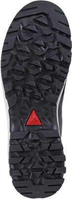 Dunkle Wanderschuhsohle mit ausgeprägtem Profil und rotem Dreieck.