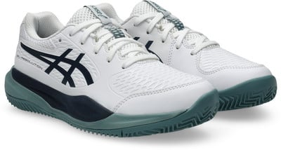 Weiße Tennisschuhe mit dunkelblauen Streifen und grüner Sohle. Weiße Tennisschuhe mit dunkelblauen Streifen und grüner Sohle.