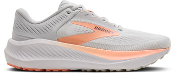 Graue Brooks Laufschuhe mit orangefarbenem Logo und Sohle.