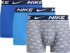 Tři pánské boxerky Nike v modrých a šedých barvách s logem značky.