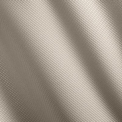 Beiger Stoff mit feinem Rautenmuster und Wellen. Beiger Stoff mit feinem Rautenmuster und Wellen.
