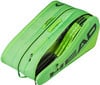 Grüne HEAD Tennisschlägertasche mit Logo, Griff und Schlägern darin.