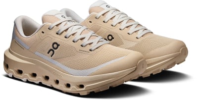 Beige Laufschuhe mit weißen Schnürsenkeln und schwarzem ON Logo. Beige Laufschuhe mit weißen Schnürsenkeln und schwarzem ON Logo.