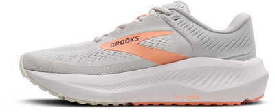 Graue Brooks-Laufschuhe mit orangefarbenem Logo und Sohle. Graue Brooks-Laufschuhe mit orangefarbenem Logo und Sohle.