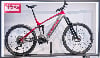 Corratec Mountain E-Bike in Rot und Silber auf einem Ständer.